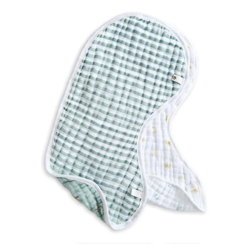 An aden + anais Sailing Seas Burpy Bib laid flat to show its contoured outline