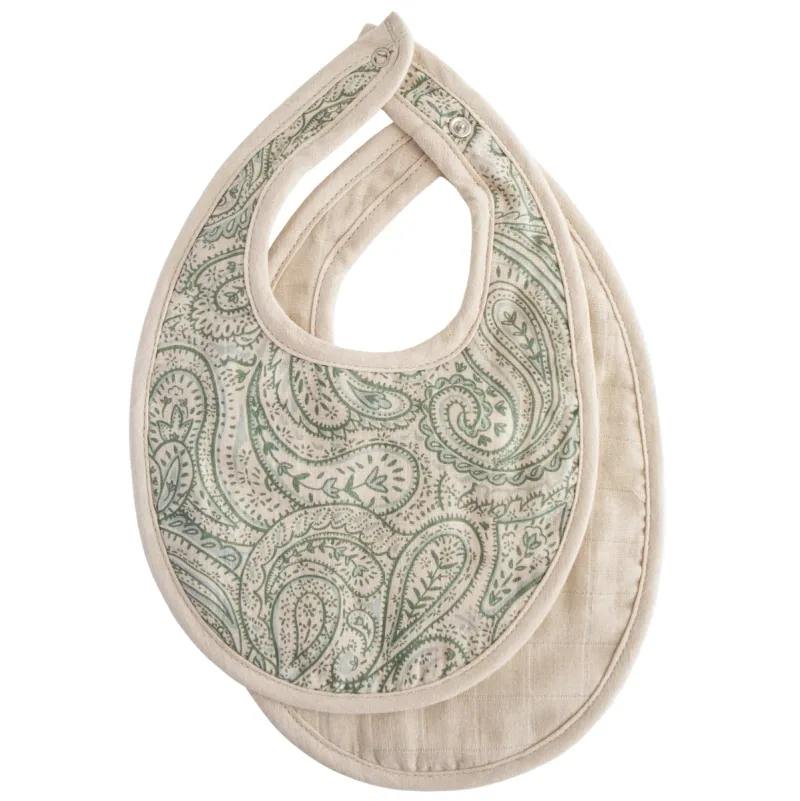 Mushie rounded muslin baby bibs with snap closures